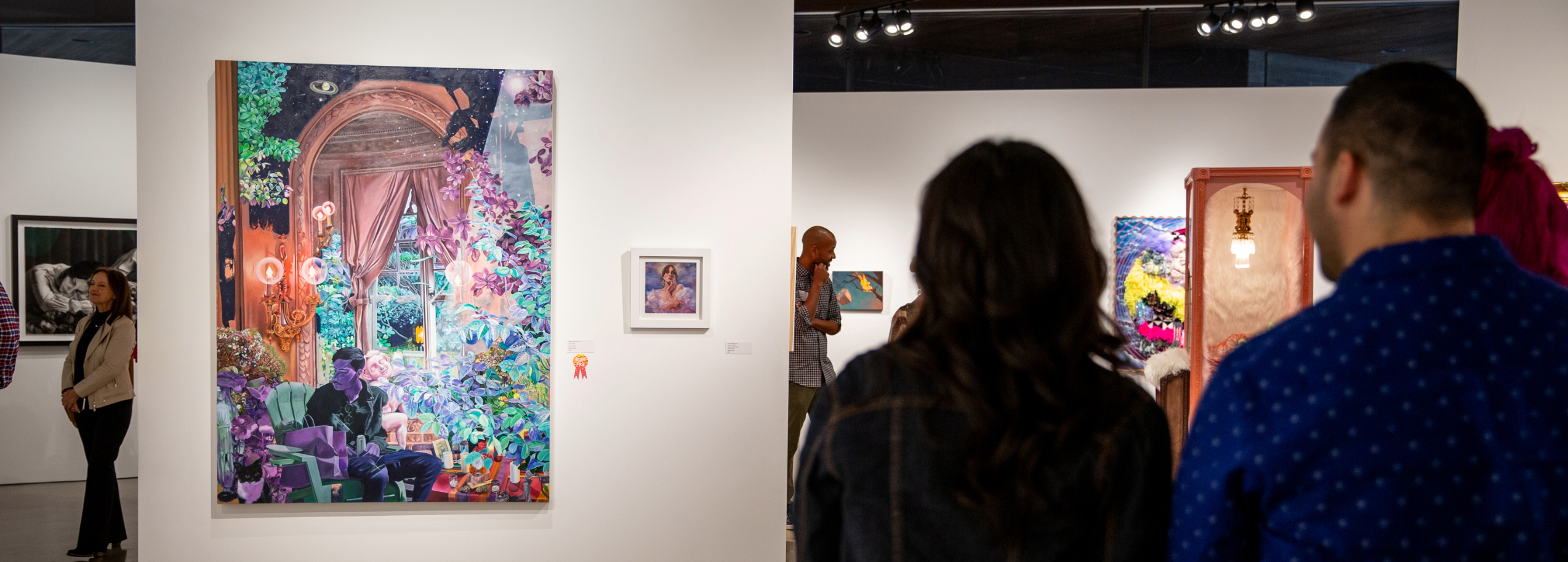 Patrons enjoying a painting